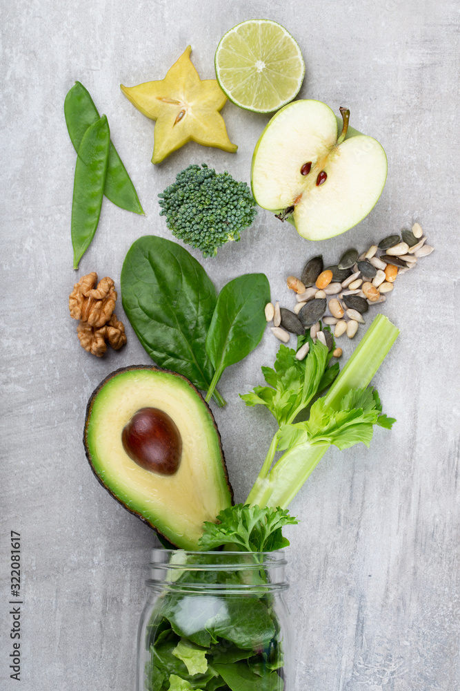 Fresh green vegetables and smoothie jar mugs. Fresh green vegetables and smoothie jar mugs.