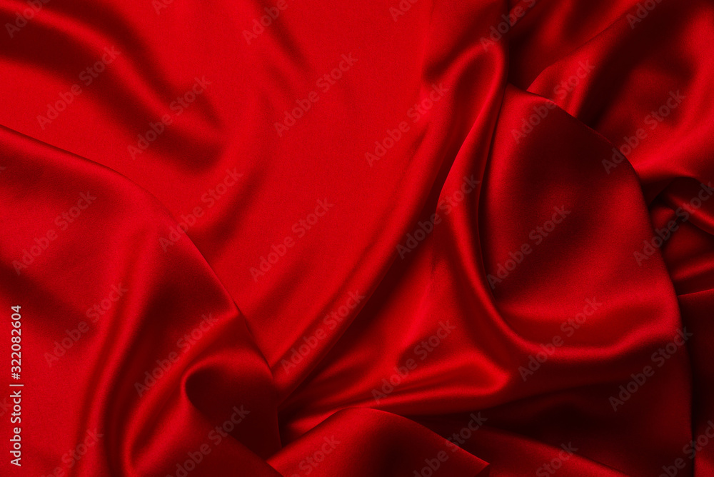 Obraz premium Red silk or satin luxury fabric texture can use as abstract background.