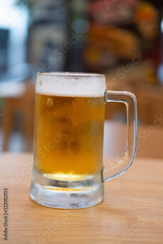 Beer in glass on wooden table