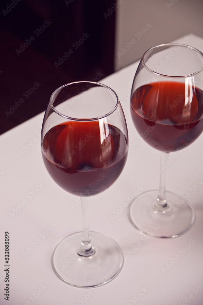 Two glasses with red grape wine. Romantic dinner concept.