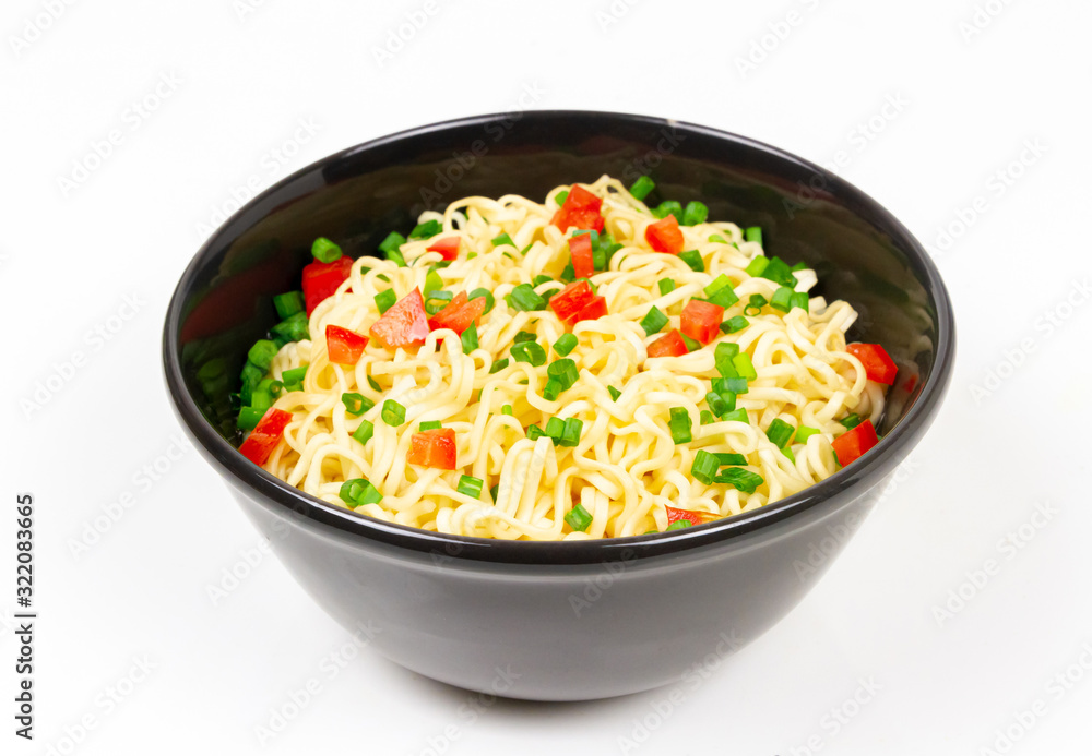 Instant noodles in black ceramic bowl isolated on white background. Instant noodles in black ceramic bowl isolated on white background.