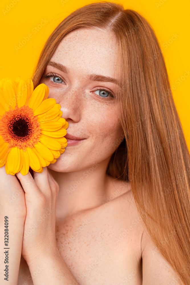 Happy ginger woman with flower Happy ginger woman with flower
