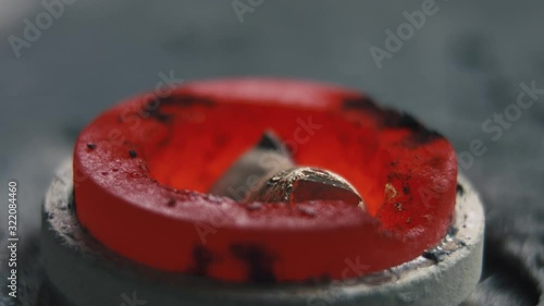 Time lapse video of precious metal blanks melting in a mold at a jewelry production