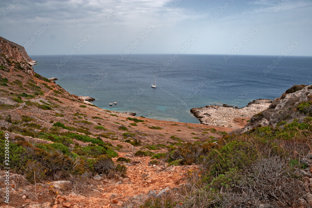 Panoramic view of the Mediterranean coast of the island of Levanzo, in the Egadi islands in Sicily, Italy.