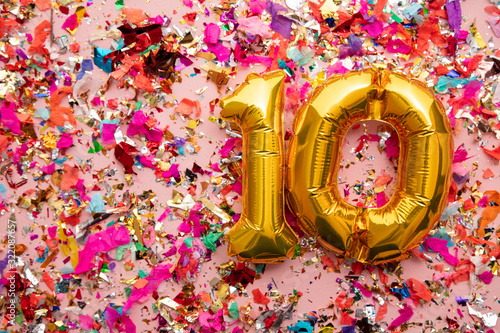 Canvas Print Number 10 gold birthday celebration balloon on a confetti glitter background