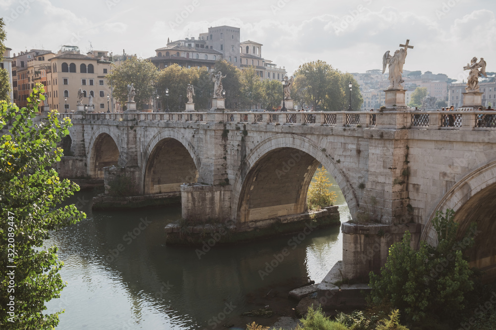 Old historical bridge on Tiber river Rome.