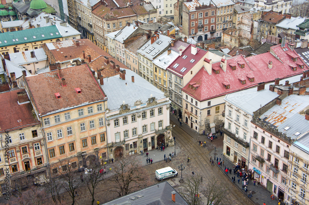 The view from the heights of the rooftops of an old European city. Background for urban architecture. Europe.