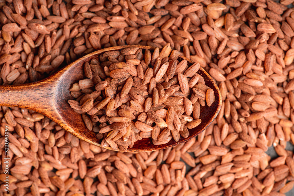 Raw red rice Dev-zira on the kitchen table. Selective focus. shallow depth of field. Raw red rice Dev-zira on the kitchen table. Selective focus. shallow depth of field.