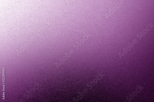 Ground glass texture with light with blur effect in purple tone.
