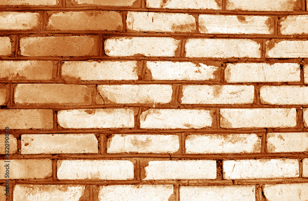 Fototapeta premium Old grungy brick wall texture in orange tone.