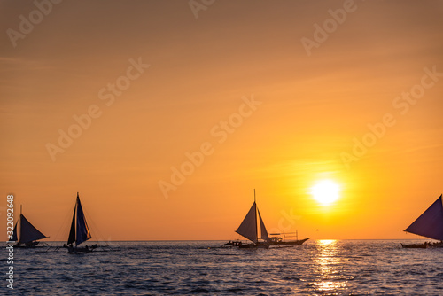 Paraw sailing at Boracay Island, Philippines at Sunset