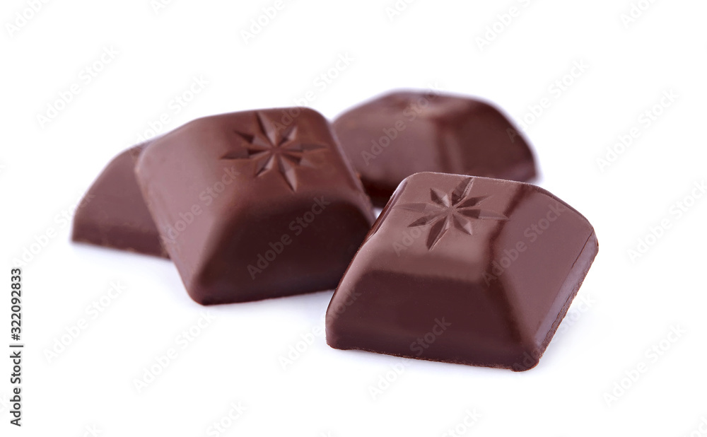 Dark chocolates on white background. Chocolate candies isolated. Dark chocolates on white background. Chocolate candies isolated.