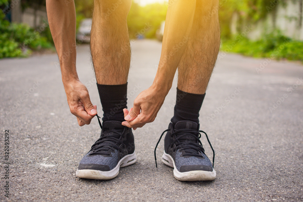 Close up man Tied shoes for Running