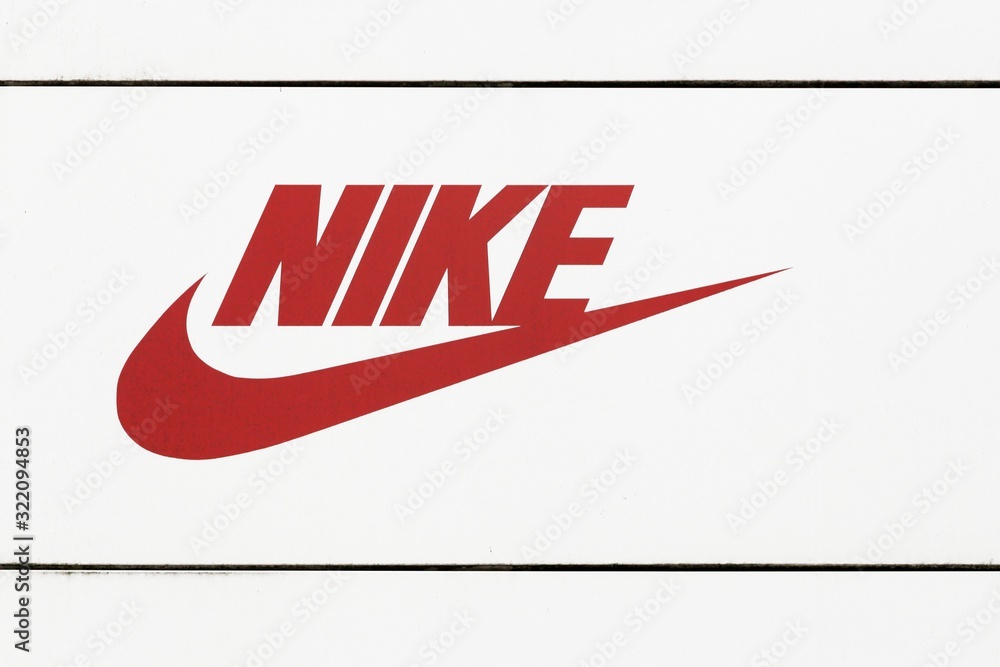 Hamburg, Germany - July 20, 2017: Nike logo facade a store. Nike is an American company specializing in sports equipment foto de Stock | Adobe Stock