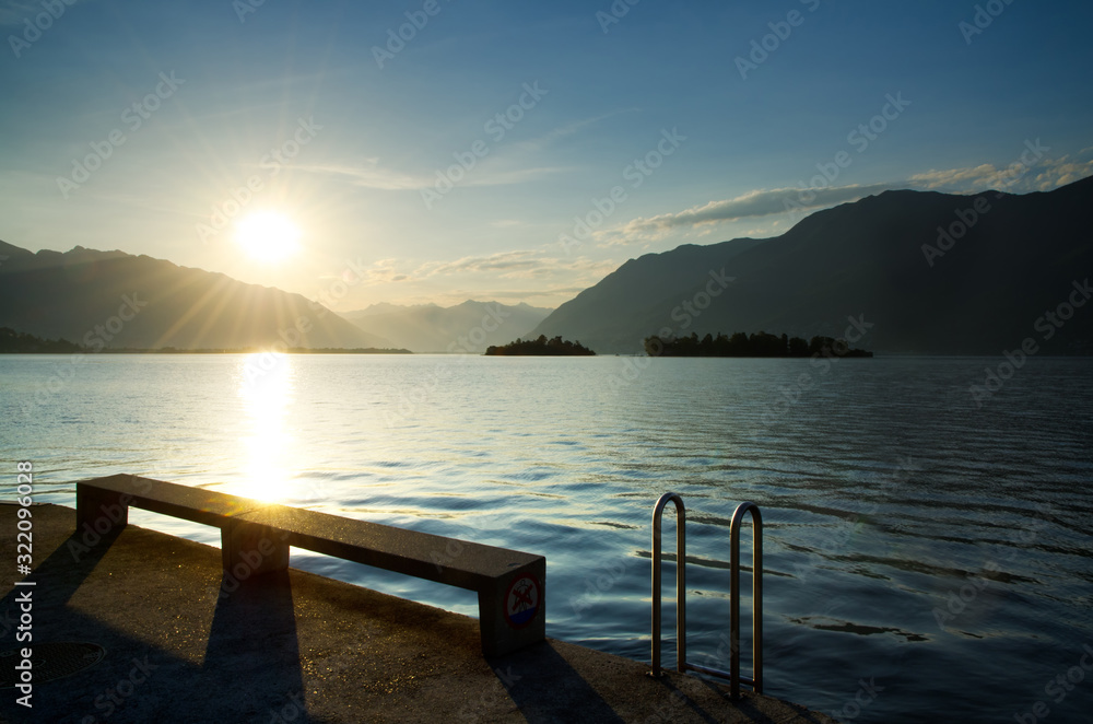 Sunrise over an Alpine Lake Maggiore with Brissago Islands and Mountain in Ticino, Switzerland.