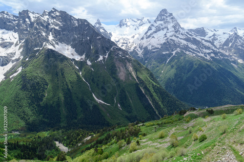 Green valley of Dombay and mountains of the Caucasian ridge