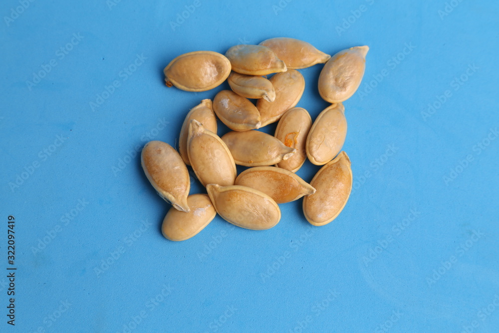 Obraz premium pumpkin seeds on color background