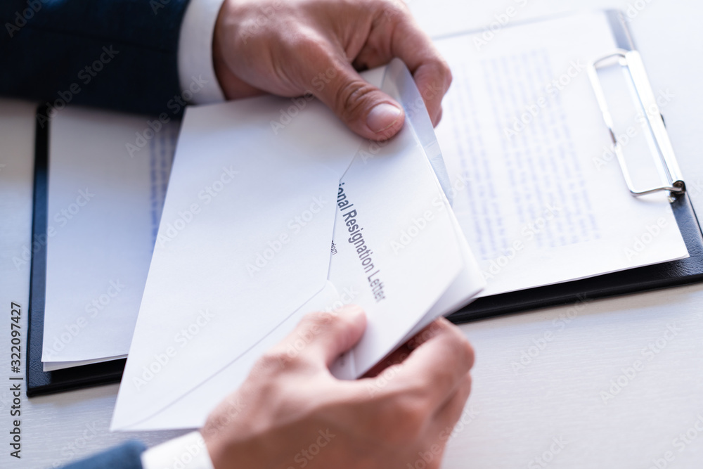 Businessman has stress to resignation and signing cancellation contract letter, Change of job unemployment or resign concept. Businessman has stress to resignation and signing cancellation contract letter, Change of job unemployment or resign concept.