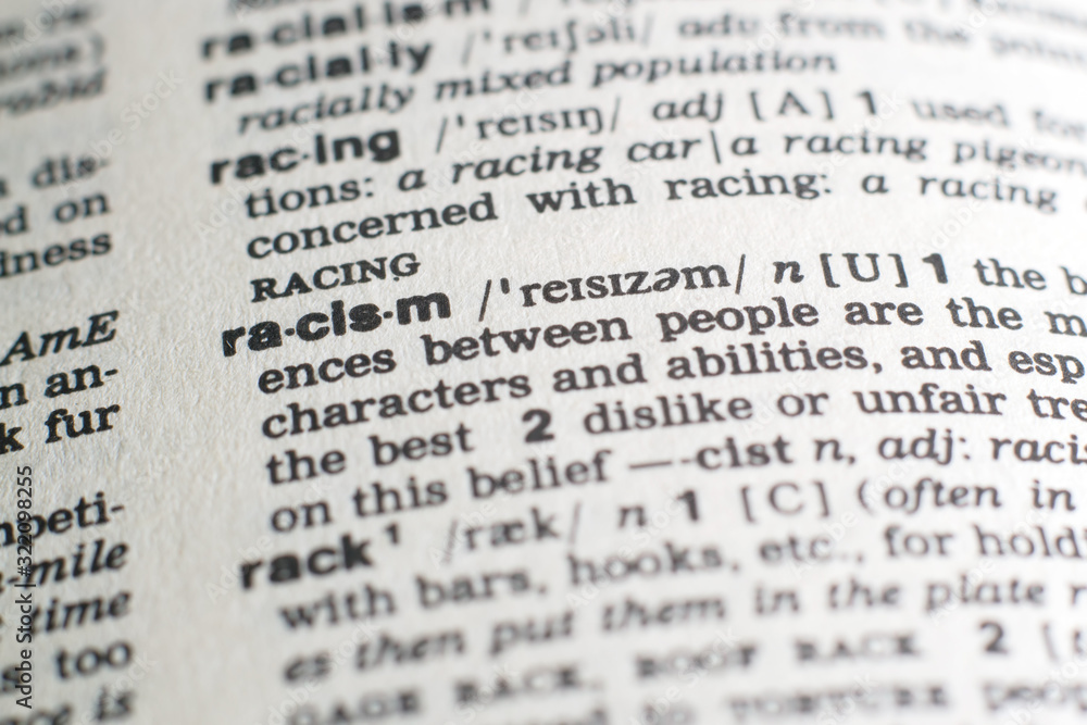 A close-up on a word Racism in English dictionary (selective focus) A close-up on a word Racism in English dictionary (selective focus)
