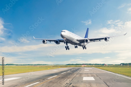 Passenger airplane is landing runway from airport morning flight.
