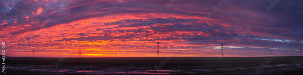 Sunrise at Ketelmeer. Panorama. electricity masts in Ketelmeer Netherlands. Energy. Power. Noordoostpolder