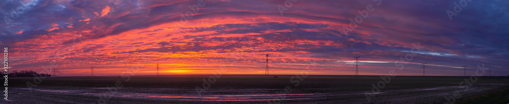 Sunrise at Ketelmeer. Panorama. electricity masts in Ketelmeer Netherlands. Energy. Power. Noordoostpolder