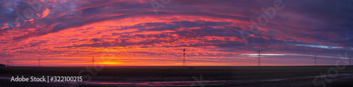 Sunrise at Ketelmeer. Panorama. electricity masts in Ketelmeer Netherlands. Energy. Power. Noordoostpolder © A