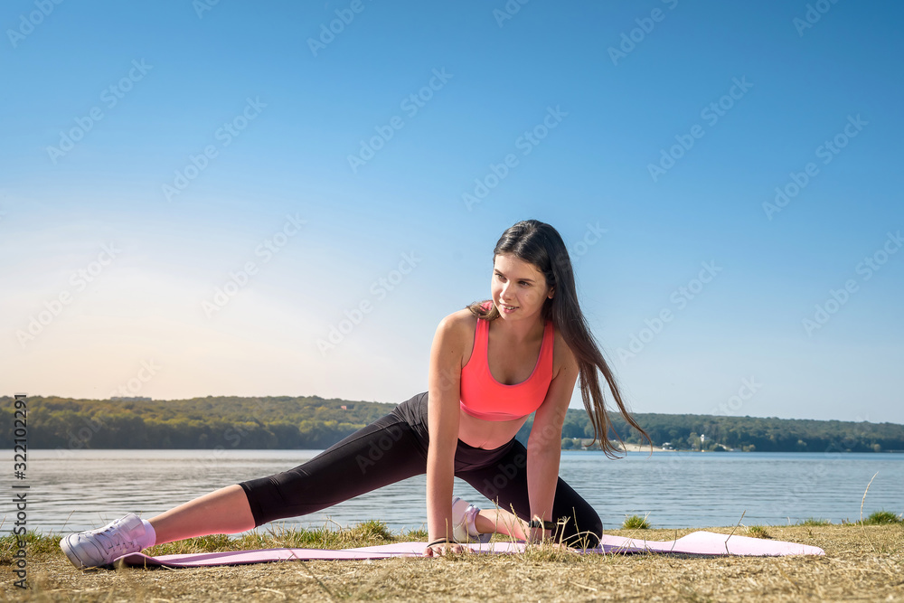 Young woman streching legs early morning before working time on outdoor
