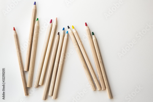 Wooden colorful ordinary pencils on a white background