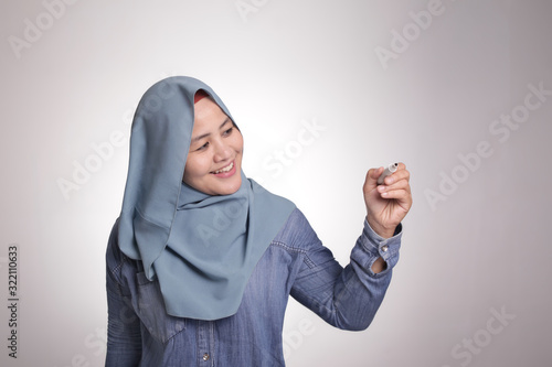Muslim Woman Writing on Virtual Screen