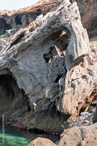 Large boulders of the rocky coast of the island of Marettimo, in the Egadi islands in Sicily, Italy.