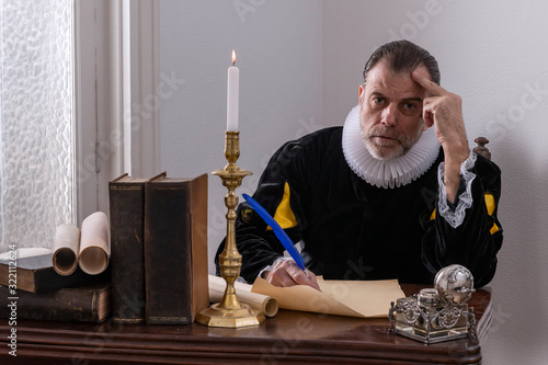 Recreation of a writer of the Spanish Golden Age (1492 to 1659), writing at his desk