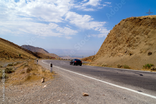 car driving on the mountain road, journey concept © Olga