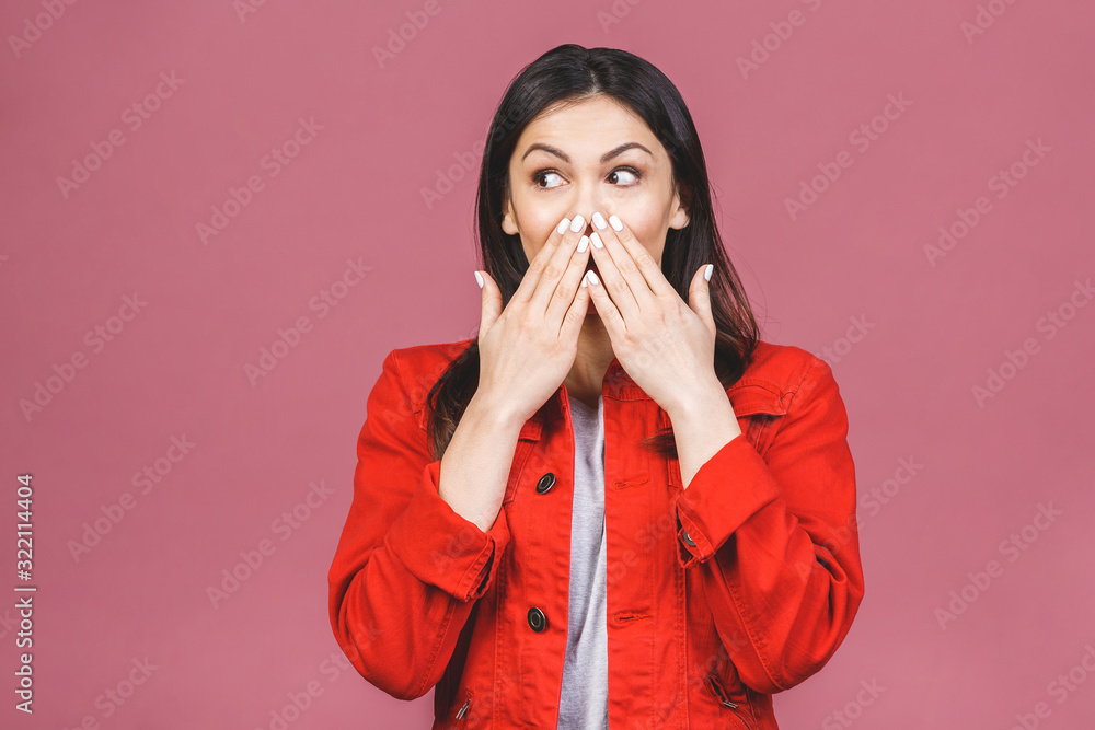Portrait of amazed shocked young woman isolated over pink background. Portrait of amazed shocked young woman isolated over pink background.