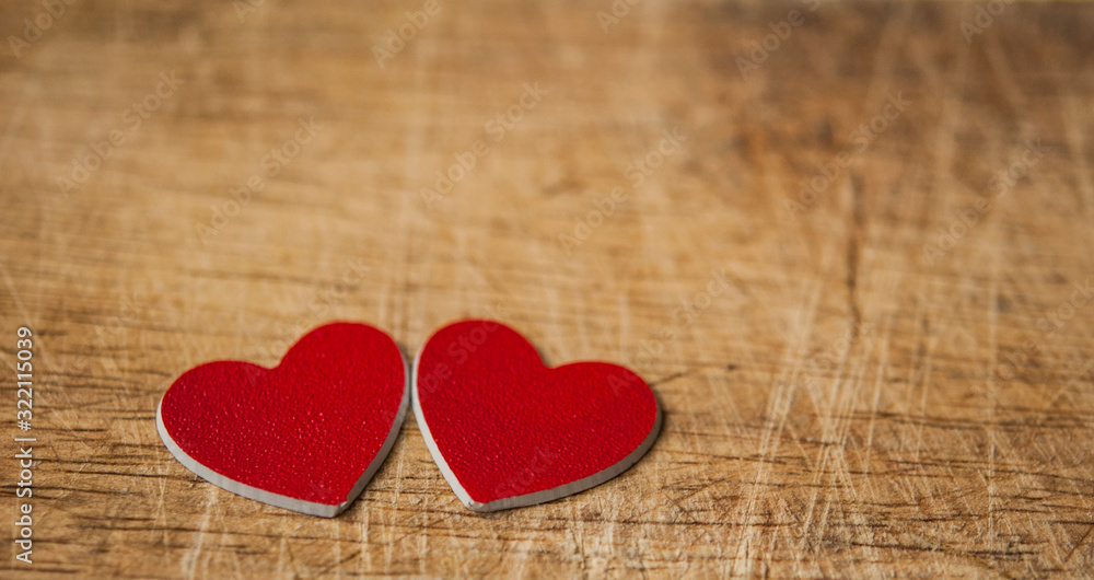 Valentine's Day card. Red hearts on wooden background. Greeting card concept. Top view