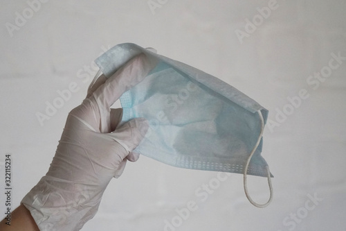 antiviral medical mask in the hands of a doctor photo