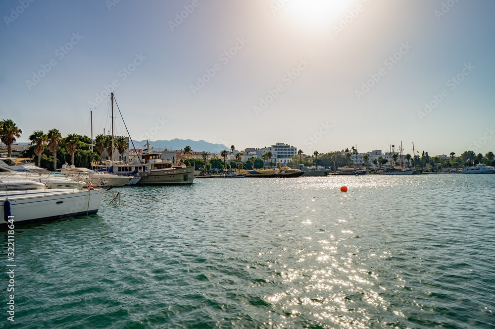 View of Kos harbor quay with ships on sunny day