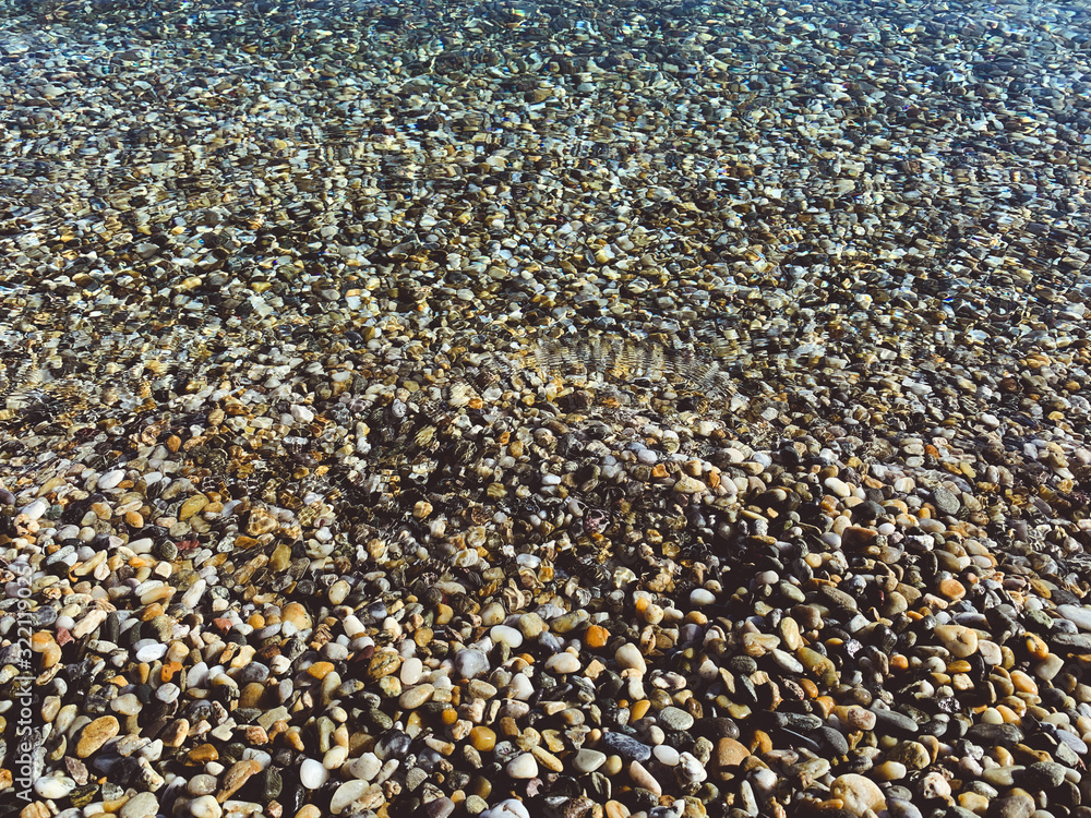 Transparent sea water with pebbles Transparent sea water with pebbles