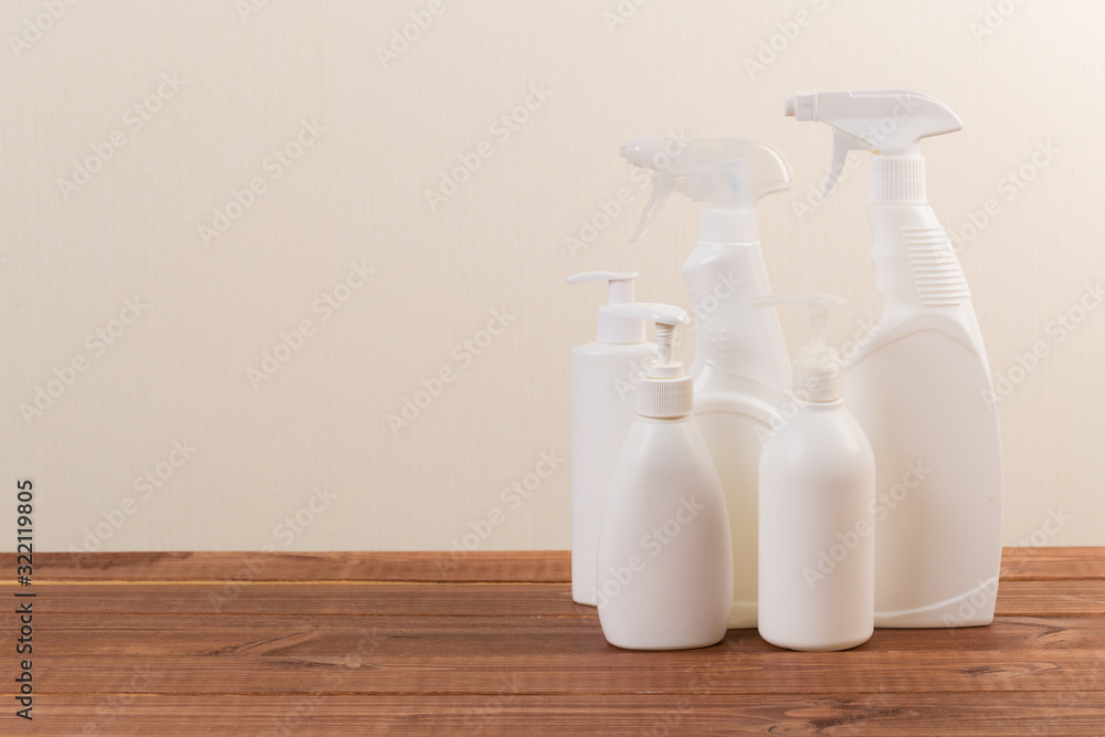 Cleaning product plastic container for house clean on wooden table and gray background . household chemicals Cleaning product plastic container for house clean on wooden table and gray background . household chemicals