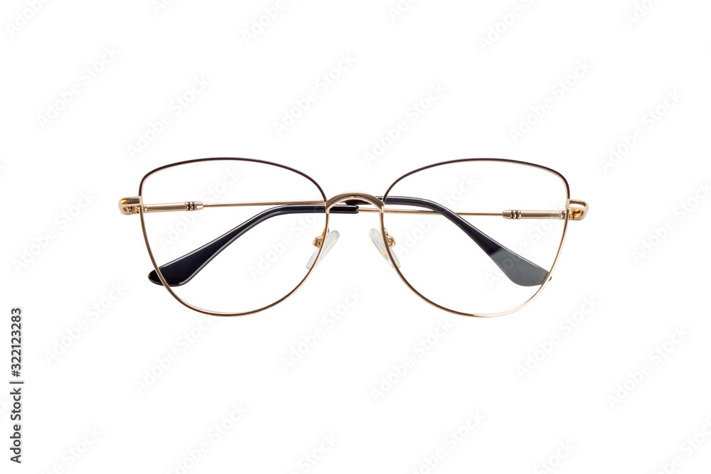 The golden female medical eyeglasses with folded temples isolated on a white background The golden female medical eyeglasses with folded temples isolated on a white background