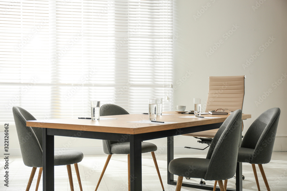 Simple office interior with large table and chairs Simple office interior with large table and chairs