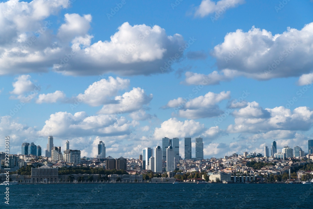 The Dolmabahce Palace and Modern Skyscrapers with Wonderful Cloudscape at The Istanbul Bosphorus