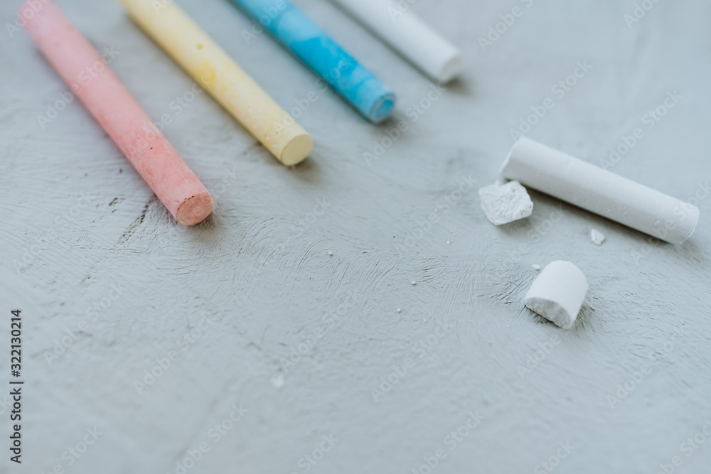 Multi-colored crayons on a gray background. Multi-colored crayons on a gray background.