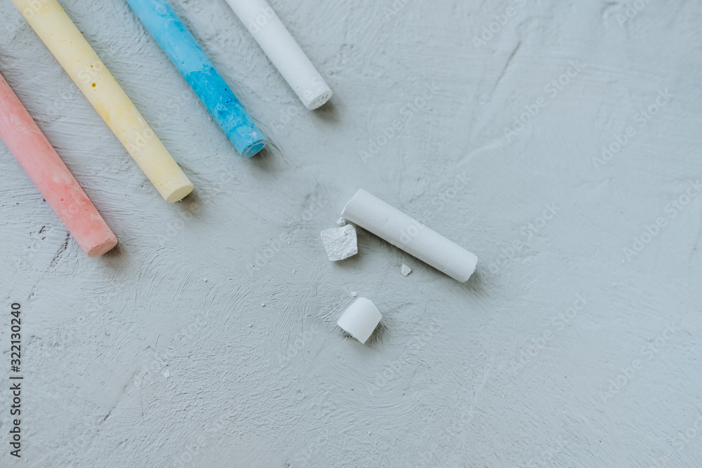 Multi-colored crayons on a gray background. Multi-colored crayons on a gray background.