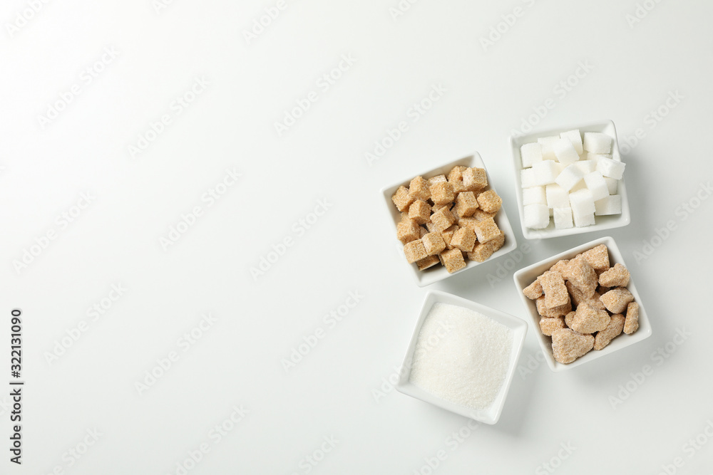 Square bowls with sugar on white background, top view Square bowls with sugar on white background, top view