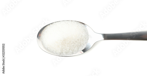 Spoon with sugar isolated on white background, close up