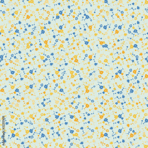 Small blue and yellow wild flowers seamless vector pattern. Girly surface print design. Great for fabrics, stationery and packaging.