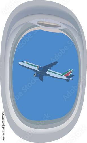 oblò finestrino dell'aereo con in lontananza aereo 