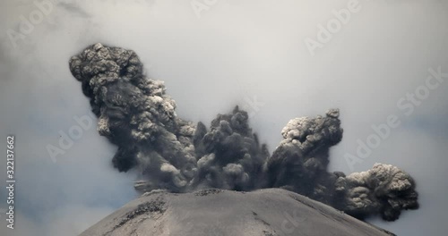 Spectacular volcanic eruption. Huge boulders are thrown from the ash cloud. Reventador volcano erupting in February 2020, situated in a remote part of the Ecuadorian Amazon surrounded by rainforest.