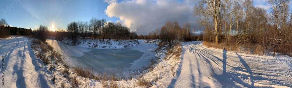 Panoramic view with winter river and snow forest. Beautiful winter landscape Panoramic view with winter river and snow forest. Beautiful winter landscape